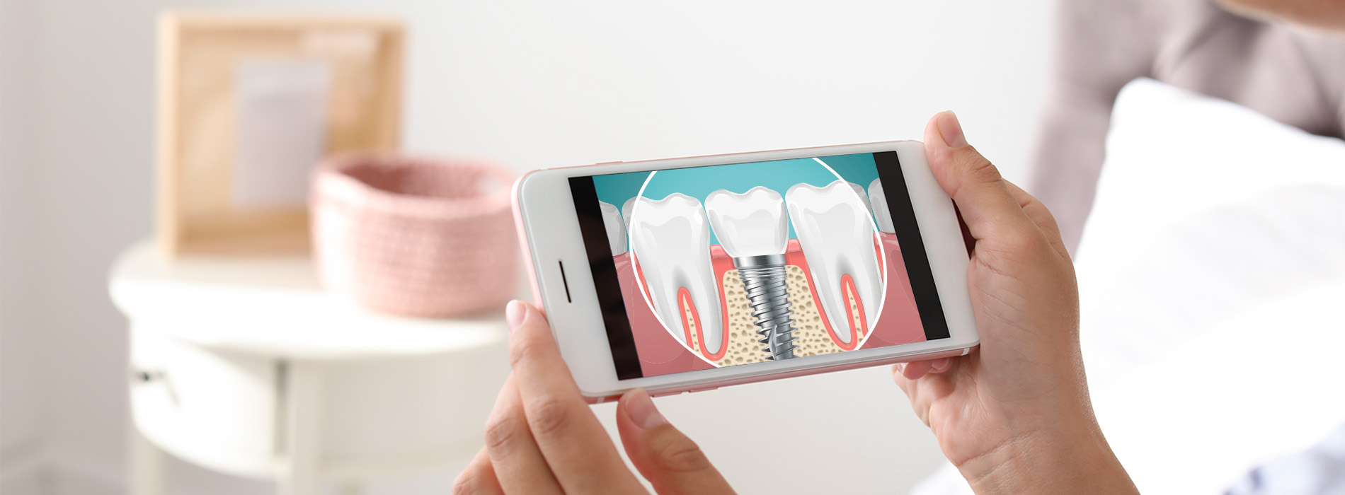 A person holding a smartphone displaying an animated toothbrush cleaning teeth.
