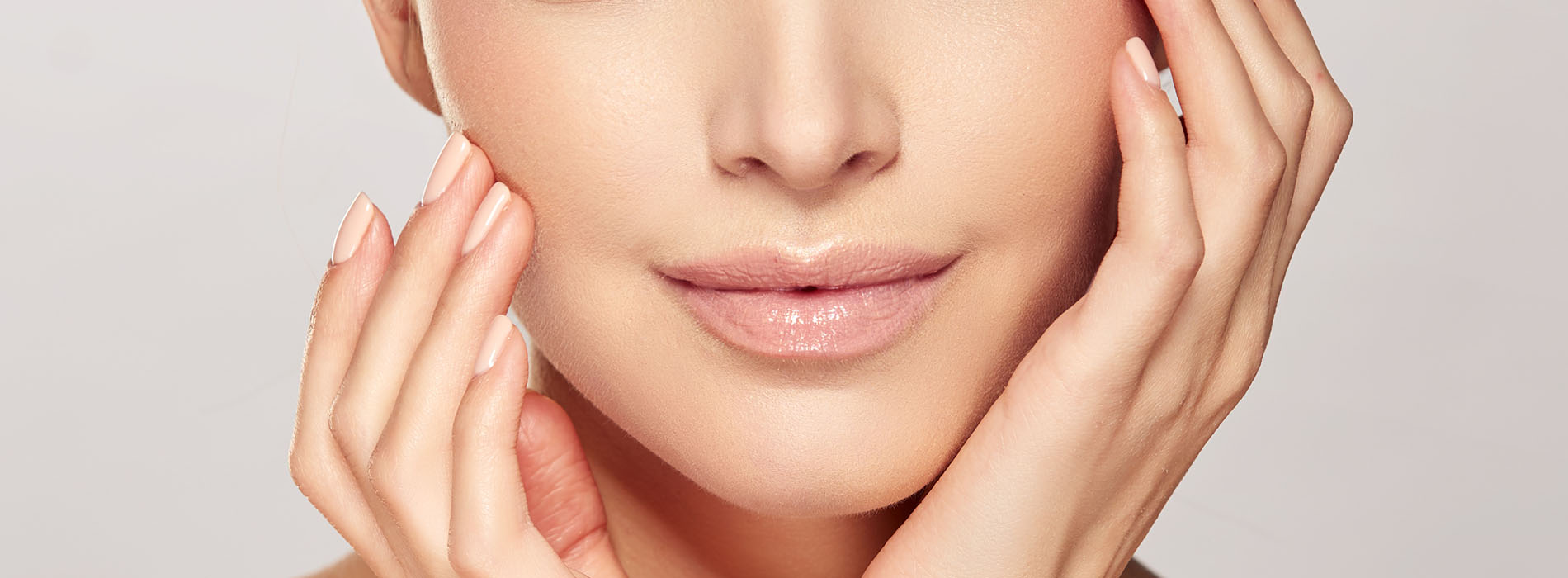The image shows a close-up of a person s face with their eyes closed, focusing on their facial features, such as the nose, lips, and chin, while maintaining a neutral expression.